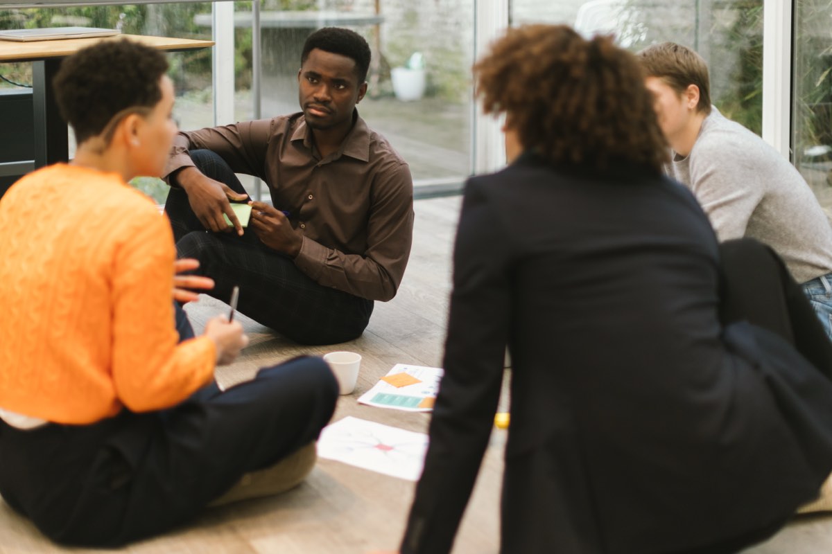 A small group sitting together in conversation